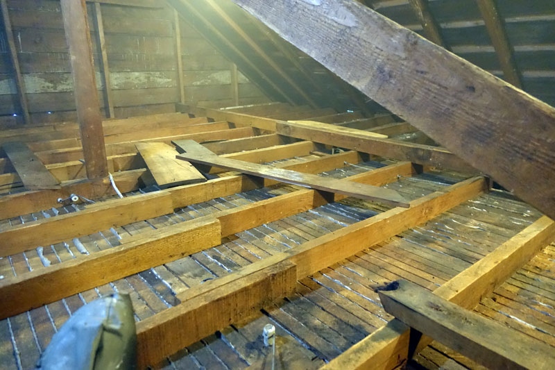 Attic space in need of asbestos removal in Vancouver, highlighting asbestos abatement and safety services.