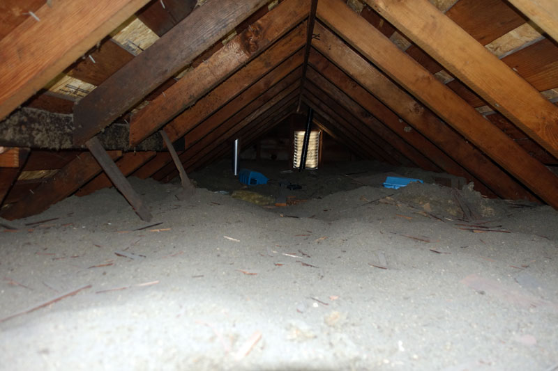 Attic space needing asbestos abatement and removal in Vancouver; hazardous materials testing for safety and LEED standards.